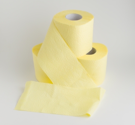 several rolls of soft toilet paper on a white backgroundの写真素材