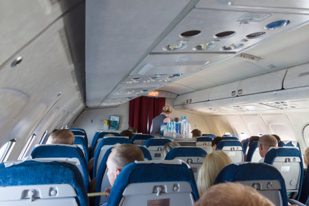 plane salon with passengers flying to other country