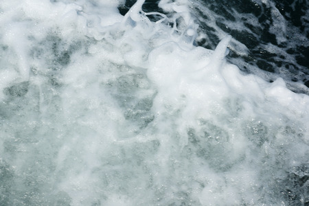 sea foam formed after the floated shipの写真素材