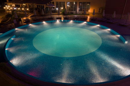 night hotel with the pool and trees the excellent vacation spot of touristsのeditorial素材