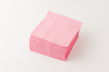 pile of pink tissues on a white backgroundの写真素材