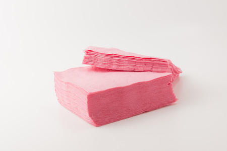 pile of pink tissues on a white backgroundの写真素材