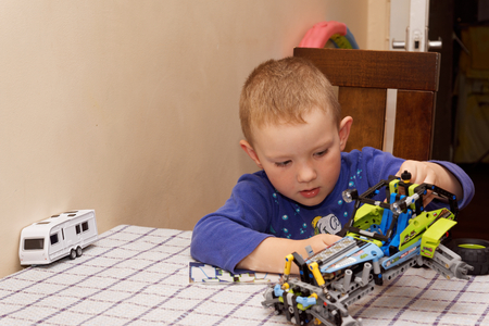 BORISOV, BELARUS - OCTOBER 08: the father with the son assemble the car from the designer in October 08, 2015, Borisov, Belarusのeditorial素材