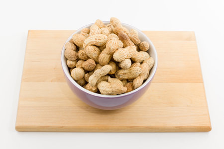 the plateful of a peanut costs on a plate on a white background