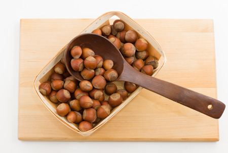 the kitchen utensils with wooden containers full of nutsの写真素材