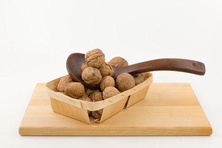 the kitchen utensils with wooden containers full of nutsの写真素材