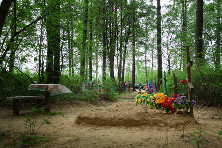 Borisov, Belarus - 10 May 2016: Radunica - spring holiday of remembrance of the dead in the eastern Slavs. People come to the cemetery to remember deceased relatives.のeditorial素材