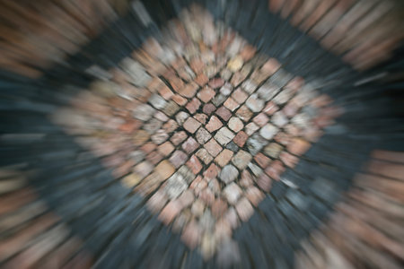 Road site laid out by small color stones in the form of squares.
