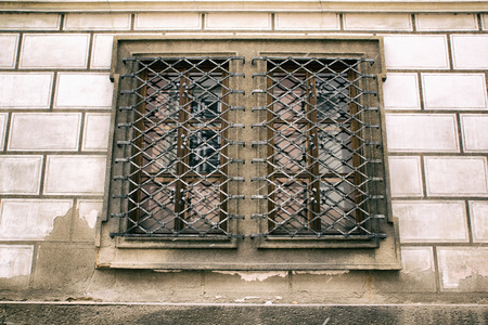 The window is located in Prague and only an inquisitive mind will be able to determine that it is not the prison and storage of wine!の写真素材