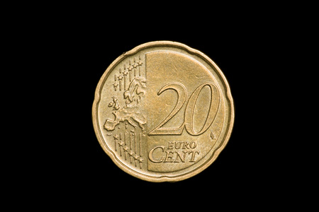 coins lie on a black background close upの写真素材