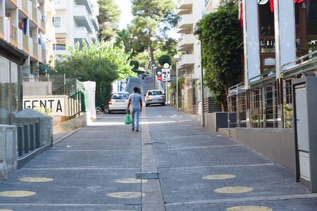Salou, Spain - August 13, 2017: Salou is one of the largest tourist cities in Spain. Pedestrian streets with hundreds of tourists.のeditorial素材