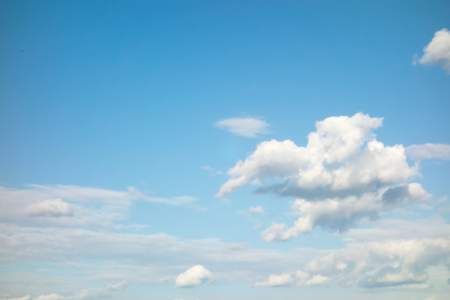 lot of white clouds hanging against the blue skyのeditorial素材