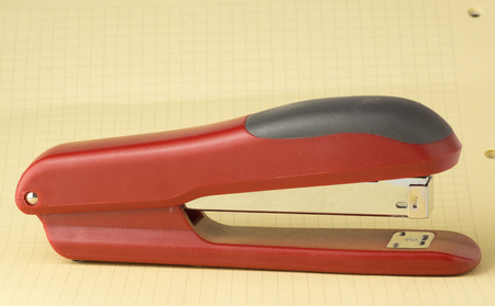 new stapler for stapling papers on a tableの写真素材