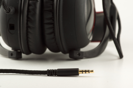 black fashionable headphones isolated on white backgroundの写真素材