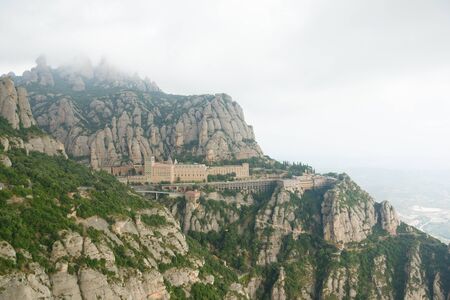 Montserrat, Spain - August 18, 2018: Santa Maria de Montserrat abbey in Monistrol, in a beautiful summer day, Catalonia, Spainのeditorial素材