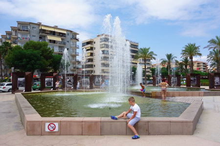 La Pineda, Spain - August 06, 2018: La Pineda is one of the largest tourist cities in Spain. In the day lights turn on in the city.のeditorial素材