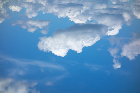 blue sky with flying white light clouds