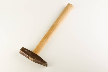 Small hammer with wooden handle isolated on a white backgroundの写真素材