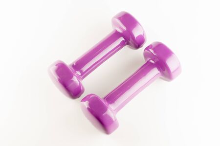 one kilogram purple dumbbell rubber coatedの写真素材