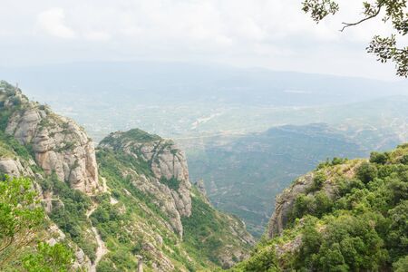 landscape with vast mountainous terrain covered with vegetationの写真素材