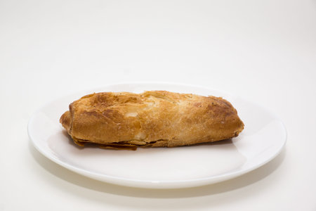 fresh baked crispy pie lies on a plate