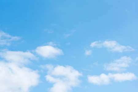 blue sky with flying white light cloudsの写真素材