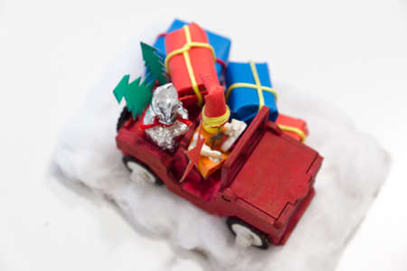 small Christmas toy homemade in the form of a car with giftsの写真素材
