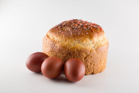 round fragrant Easter bun with colored sprinkles