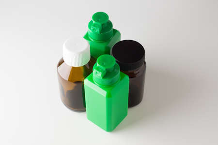 medical glass and plastic cans isolated on a white backgroundの写真素材