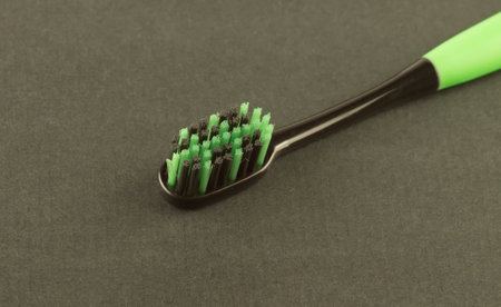 new modern toothbrush isolated on black solid backgroundの写真素材