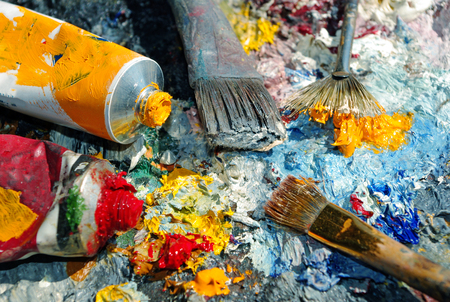 Palette of the artist with tubes of paint and brushes. Closeup.の写真素材