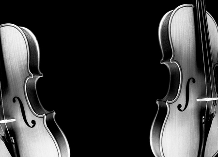 Violins on a black background.の写真素材