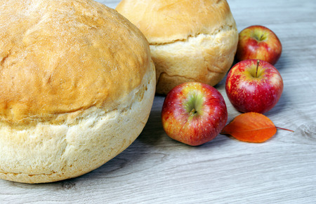 Fresh homemade wheat bread and applesの写真素材
