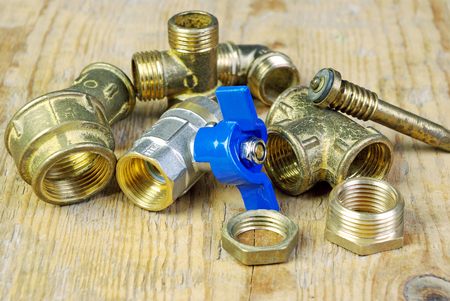 Water tap and fittings for water supply. Plumbing fixtures and piping parts. Sanitary and technical works.の写真素材