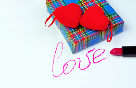 day of lovers two red hearts with gifts on a white backgroundの写真素材