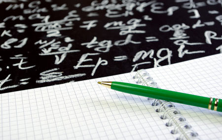 Notebook with formulas and penの写真素材