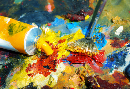 Palette of the artist with tubes of paint and brushes. Closeup.の写真素材