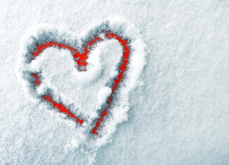 The heart of lovers in the snow. Heart is a symbol of love. Valentine's Day.の写真素材