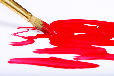 Artist brush and red brushstrokes on whiteの写真素材