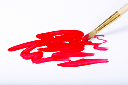 Artist brush and red brushstrokes on whiteの写真素材