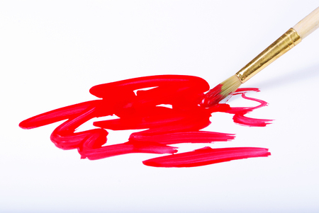 Artist brush and red brushstrokes on whiteの写真素材