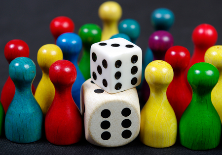 Colorful play figures with dice on board. Close up.の写真素材