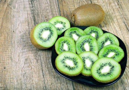Kiwi fruit on wood backgroundの写真素材