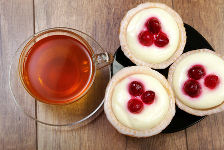 A cup of tea and cakesの写真素材