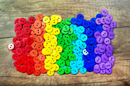 Colors of rainbow. Pattern of multicolored buttons texture background. Palette of rainbow colors....