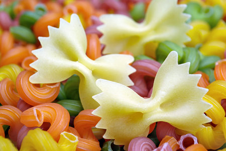 colored pasta texture background. top view