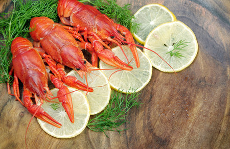 crayfish and lemons on a wooden table