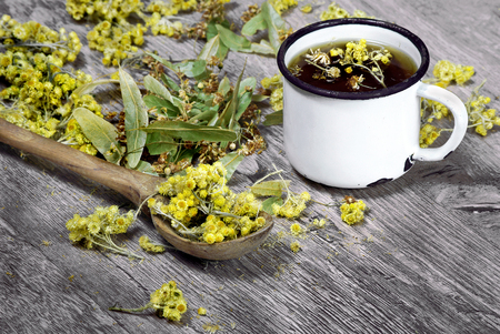 cup of herbal tea and honey. medicinal herbs. close-up. remedy for flu and coldの写真素材