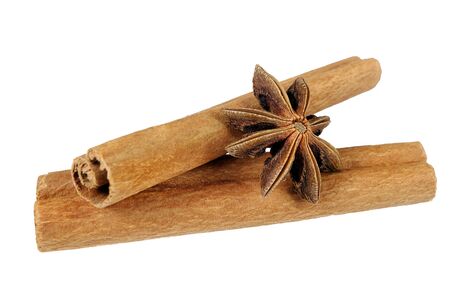 cinnamon sticks and anise star isolated on whiteの写真素材