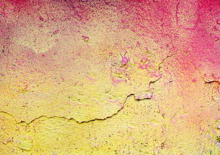 colorful painted plastered concrete wall. abstract colorful texture background. red and yellow colors of the wallの写真素材